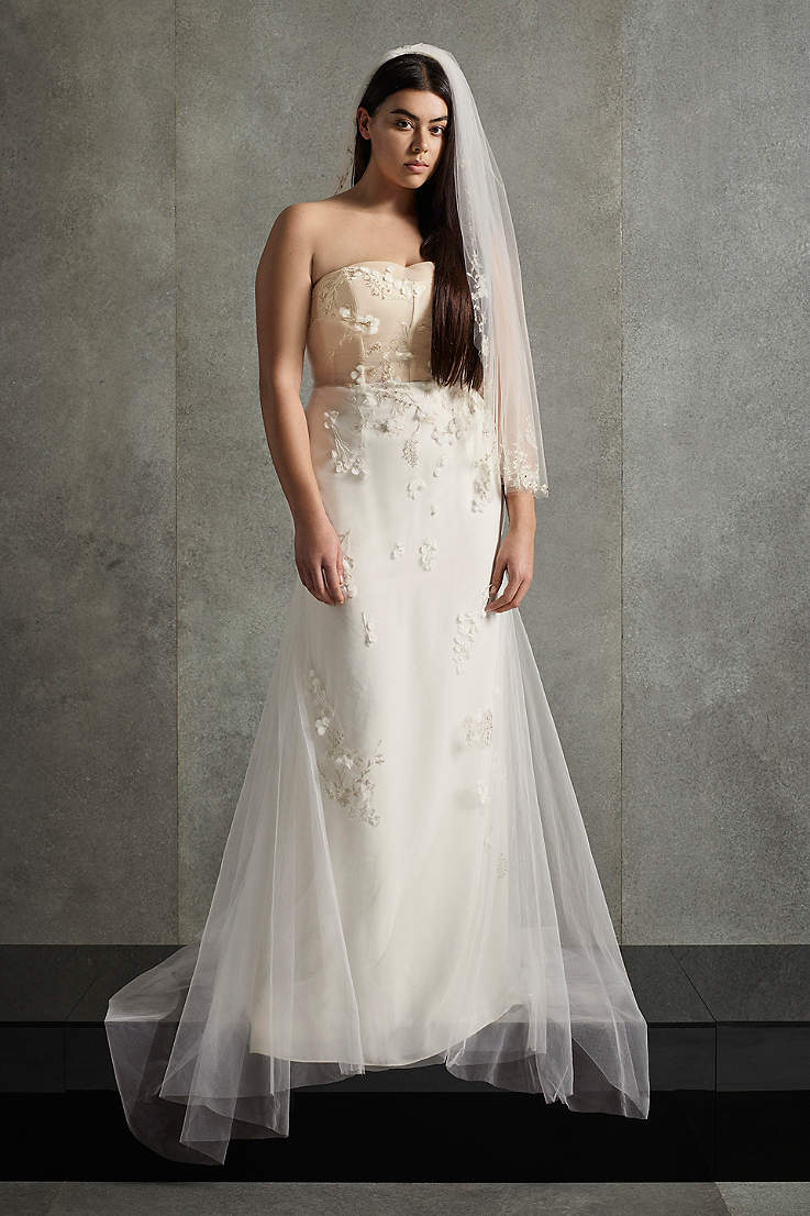 Woman with dark hair in white strapless wedding dress
