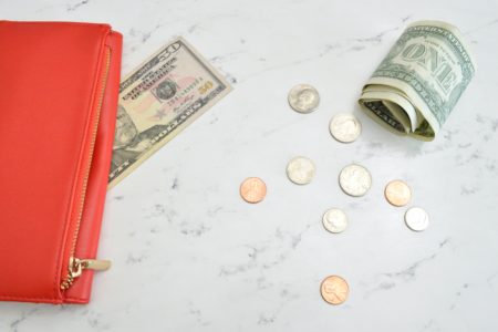 Money next to a purse