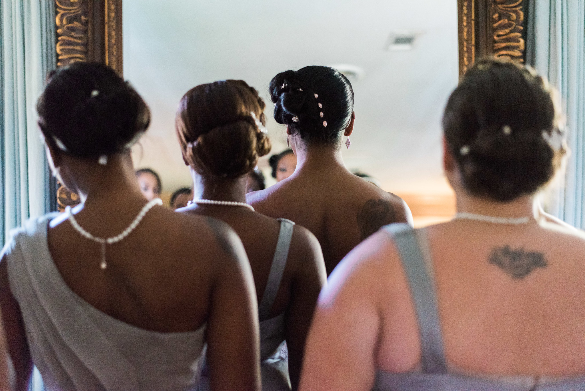 Bridesmaids waiting to enter a room