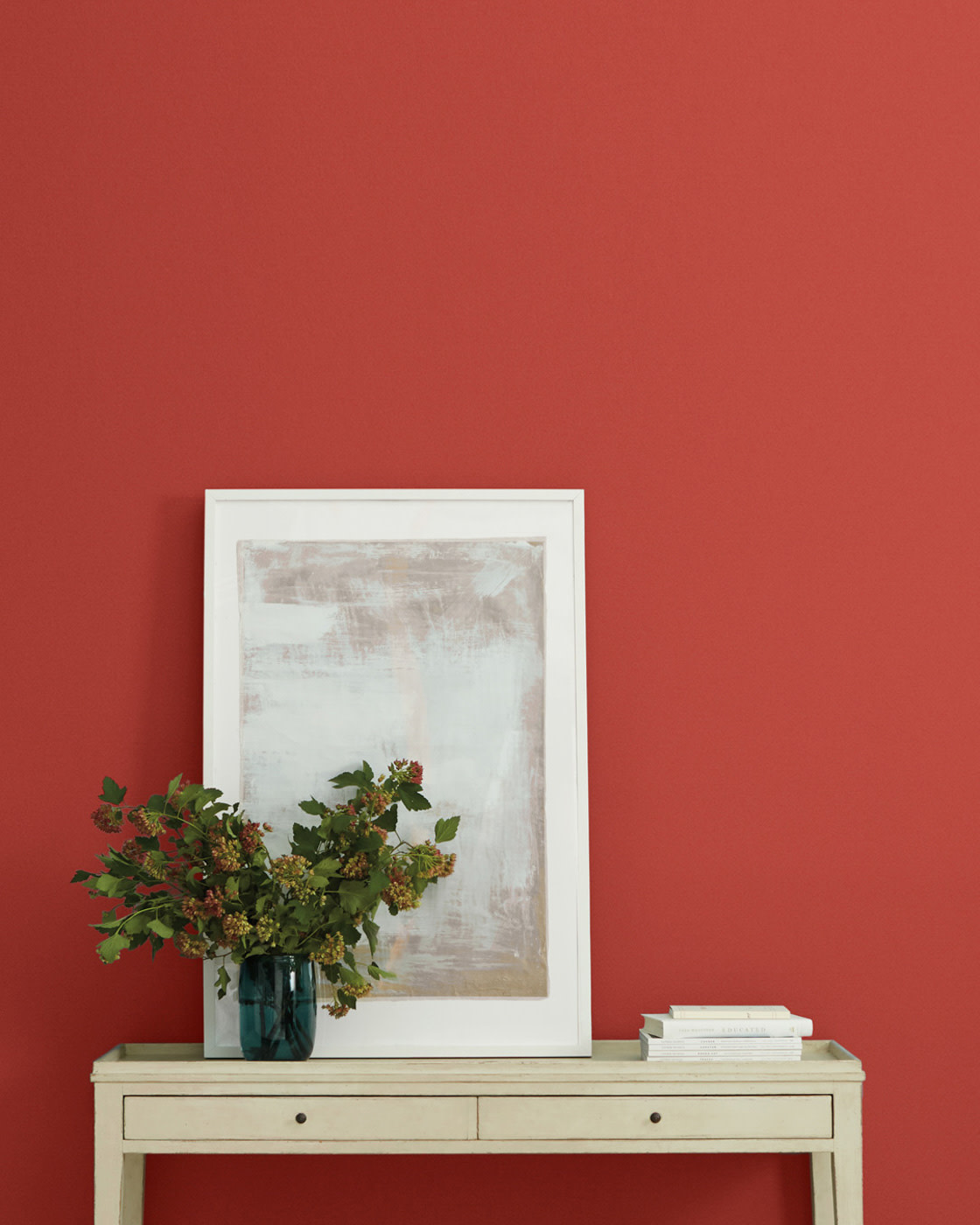 red paint from black womxn owned business, Clare, on a wall with a console table in front of it