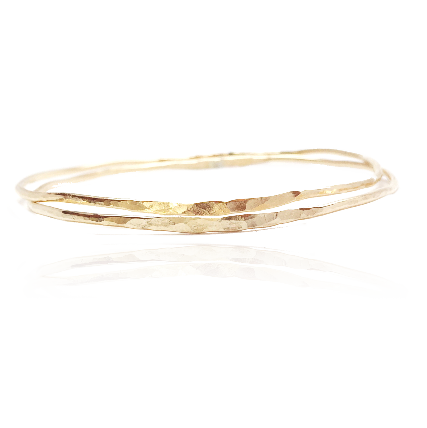 two hammered gold bangle bracelets
