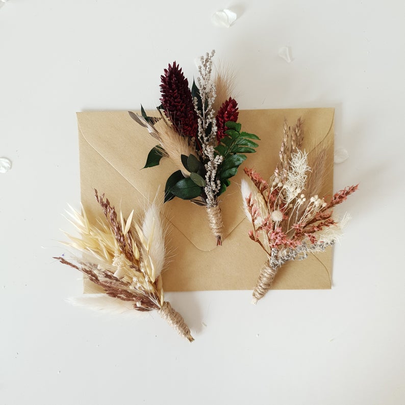 Three dried floral boutonnieres 