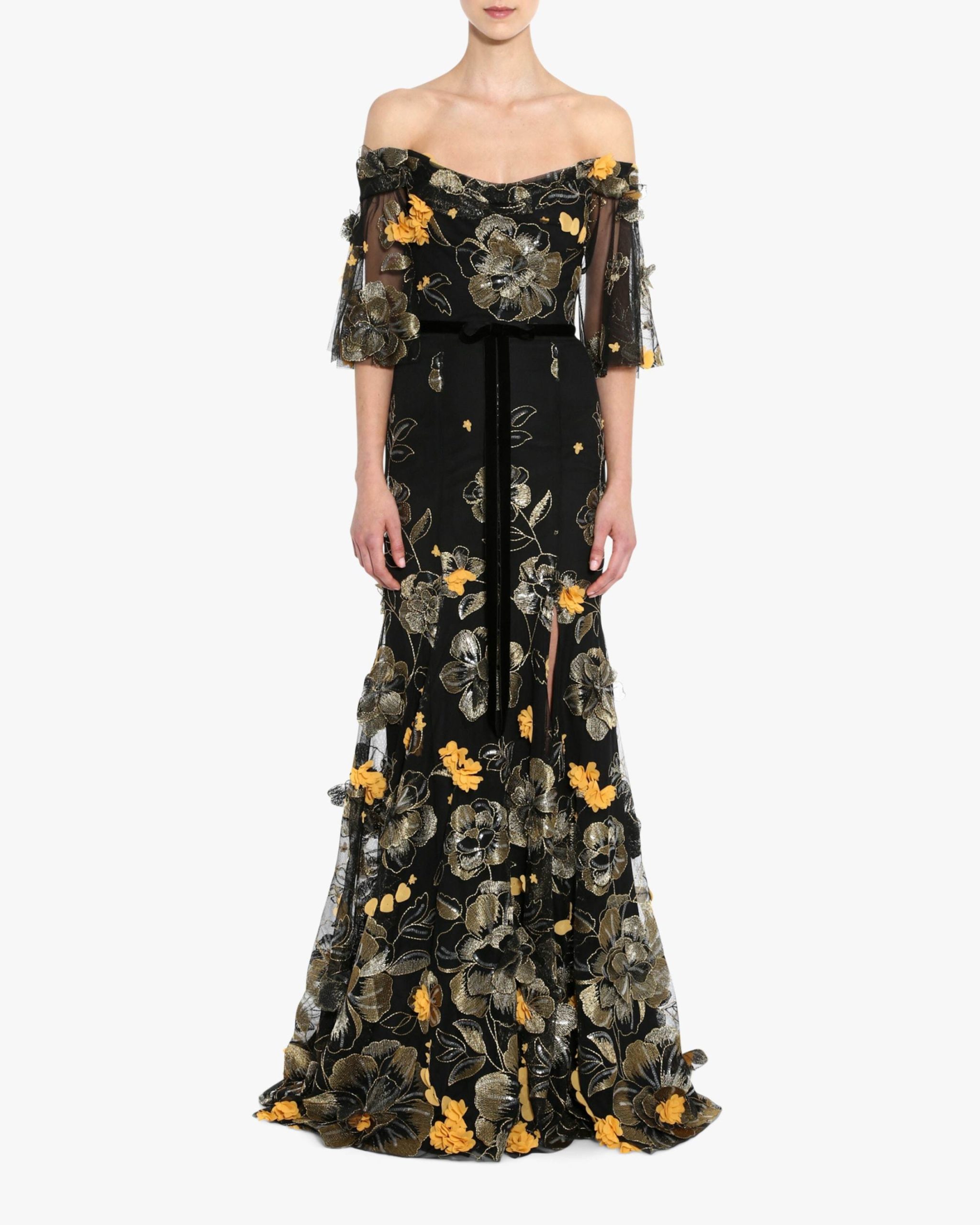 orange florals on a black dress is one of the most unique fall wedding ideas