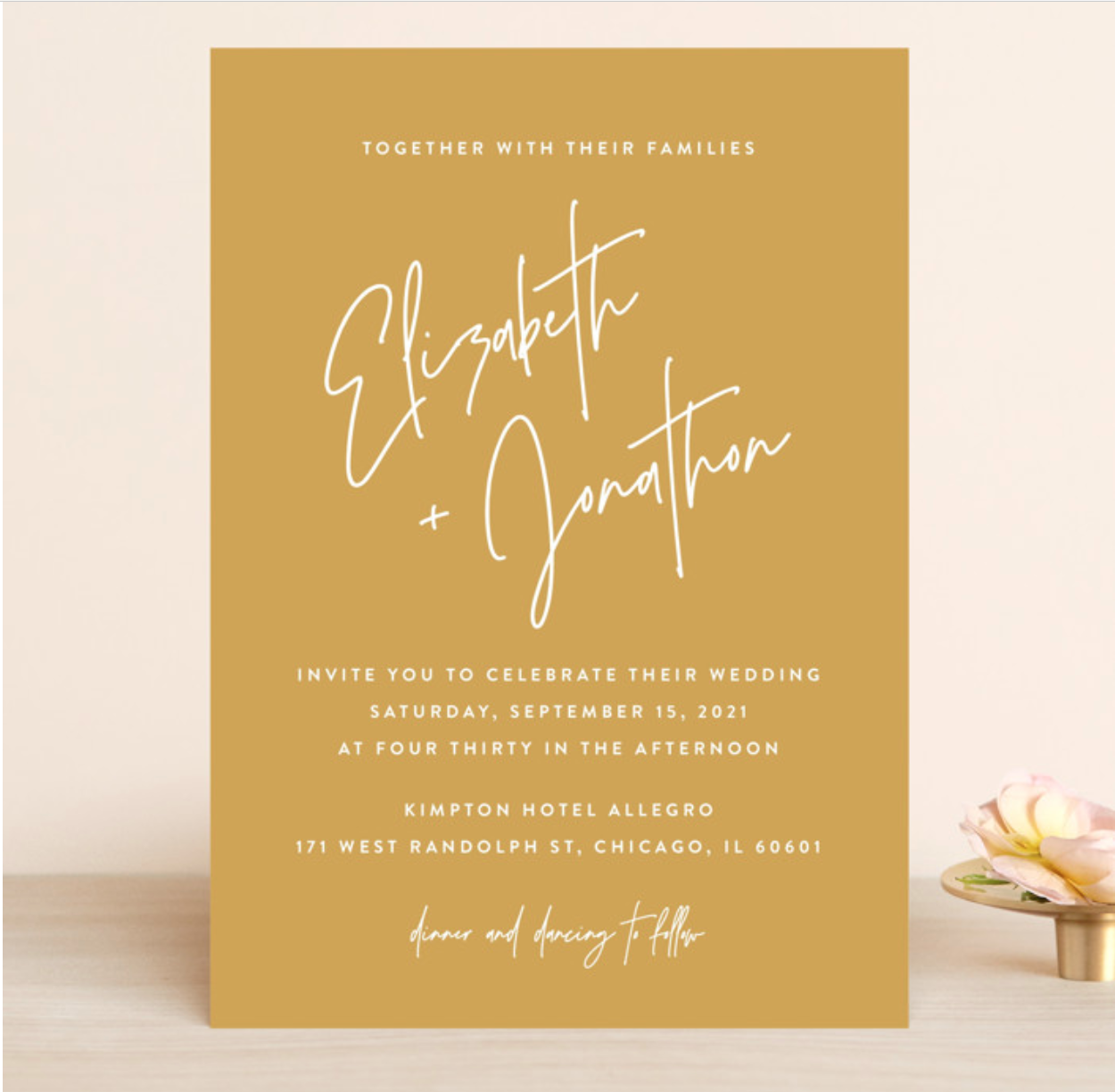 Mustard yellow wedding invite with white font