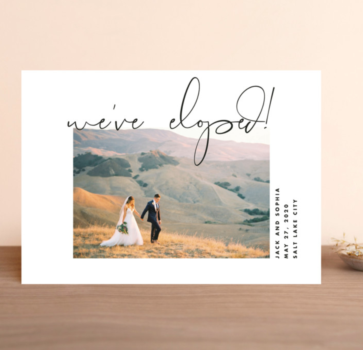 Simple white elopement announcement with image of couple and black font