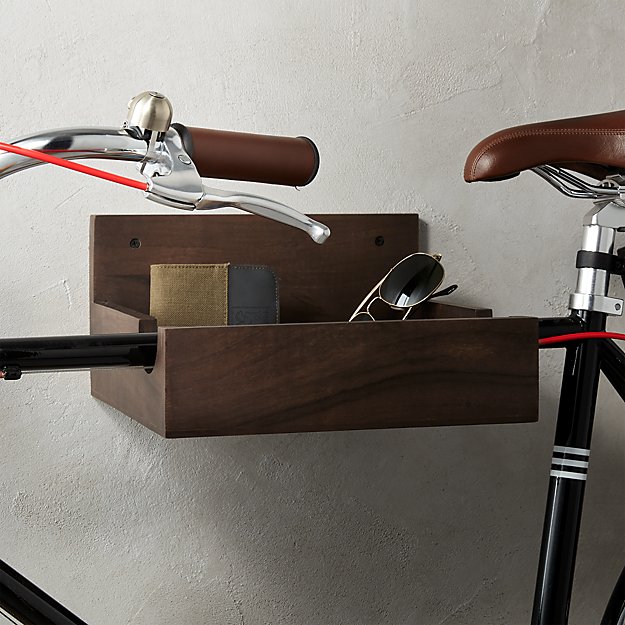 Wood open top box hanging on wall with slot to hang bicycle