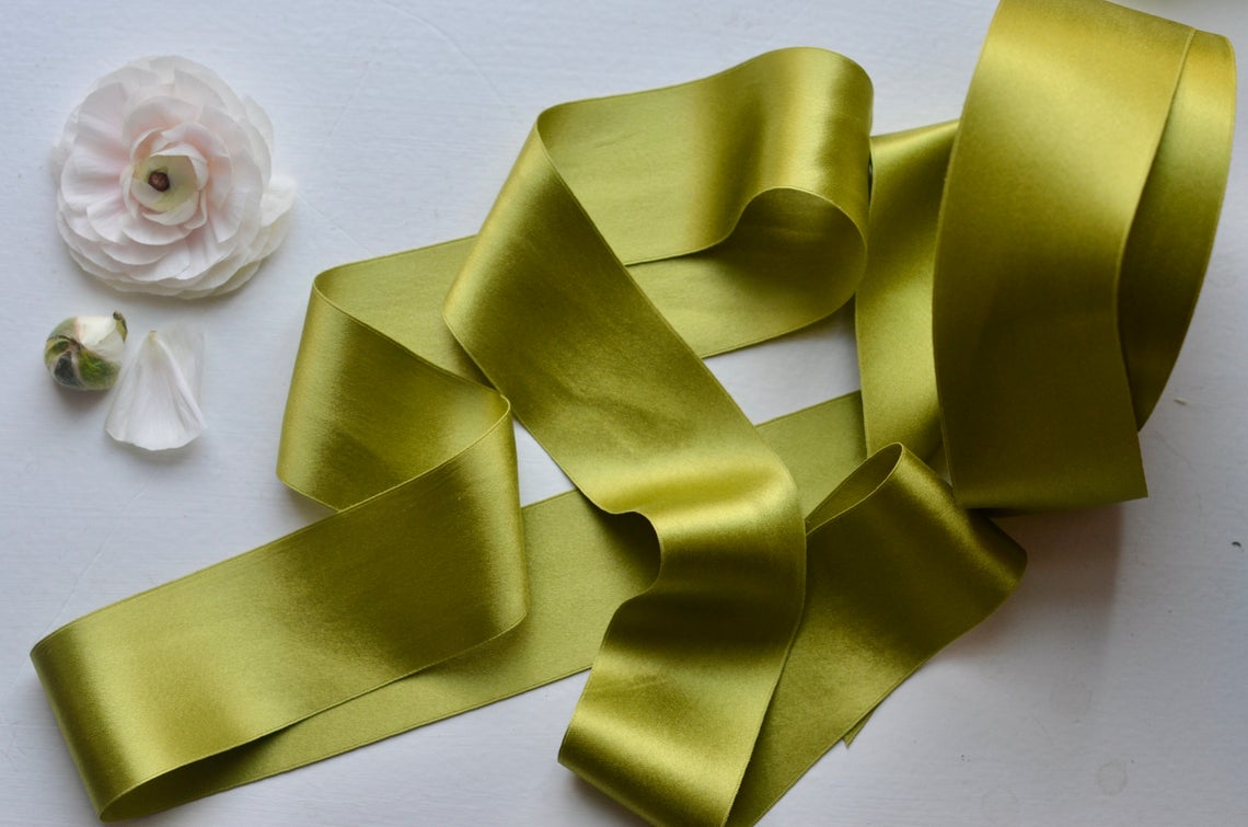 chartreuse satin ribbon on a white table