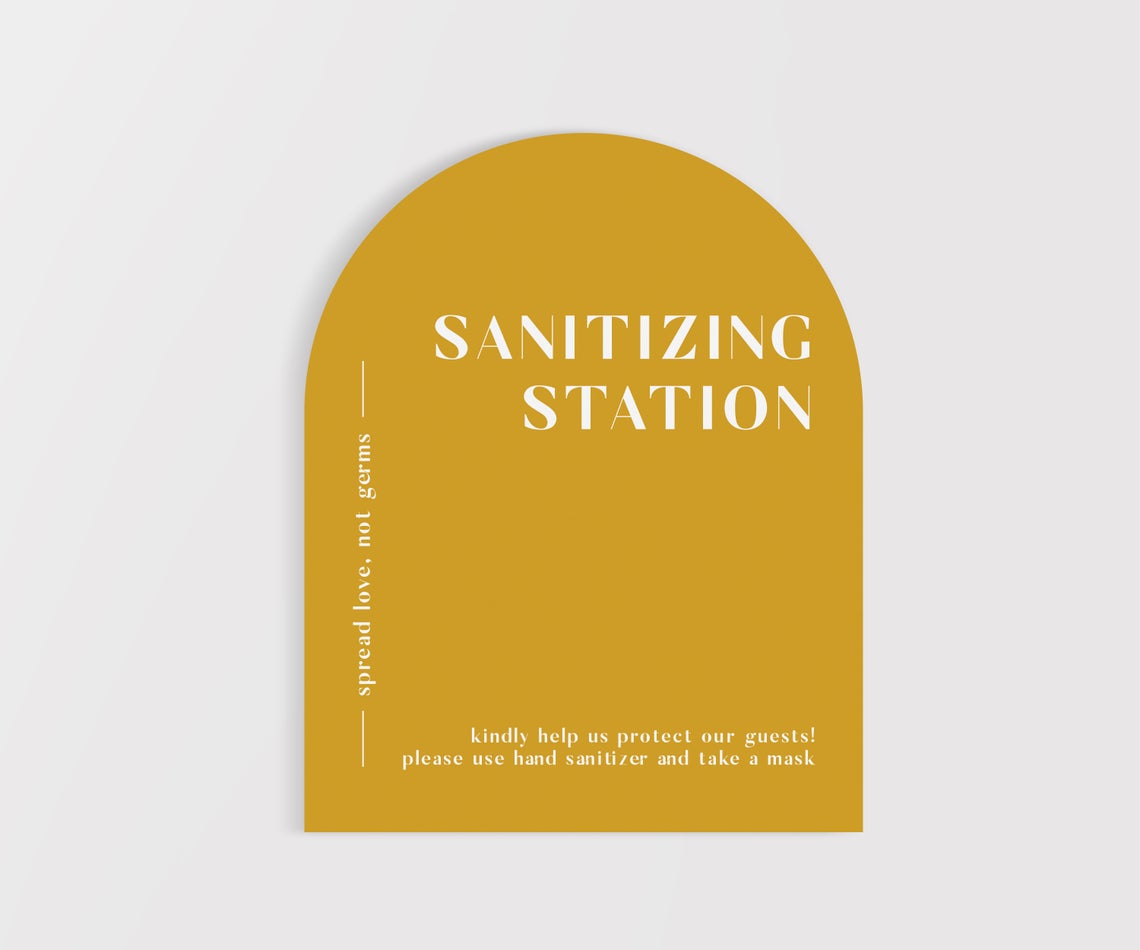 mustard yellow arched sanitizing station sign