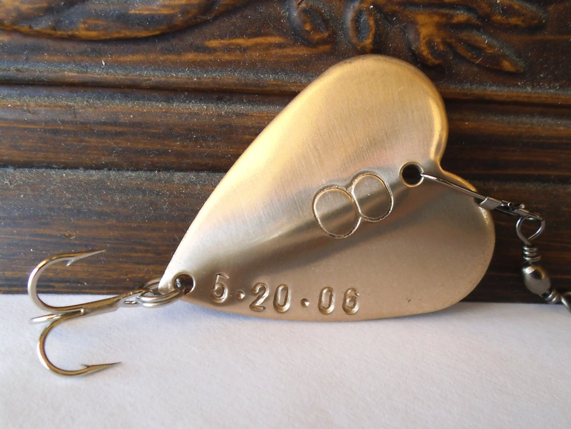 For a more traditional anniversary gift try a custom embossed bronze fishing lure in shape of a heart