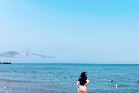 Meg walking in the ocean