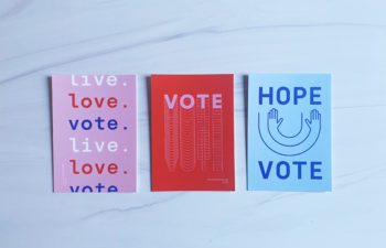 Three "vote" postcards