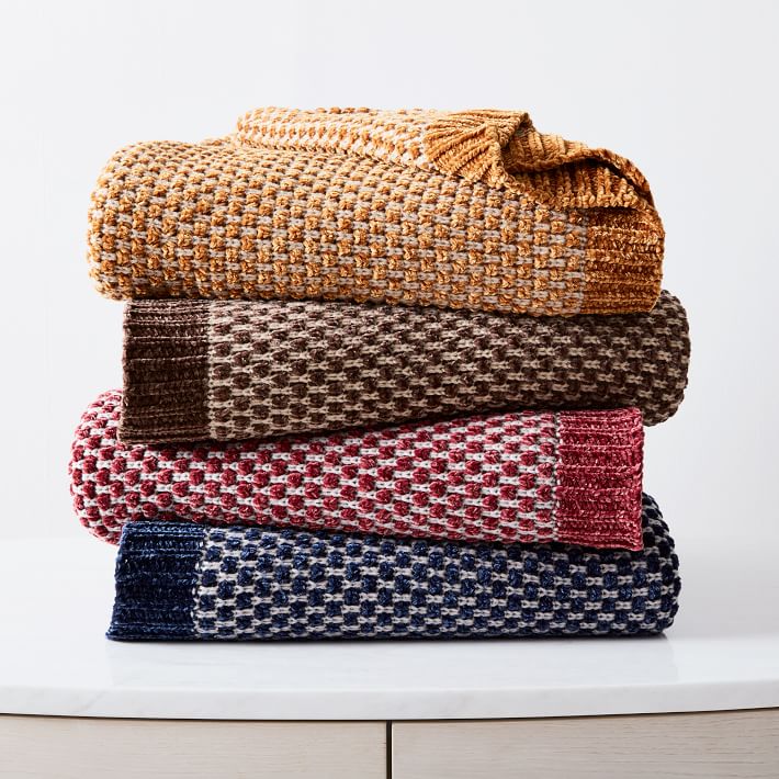 stack of fall colored blankets