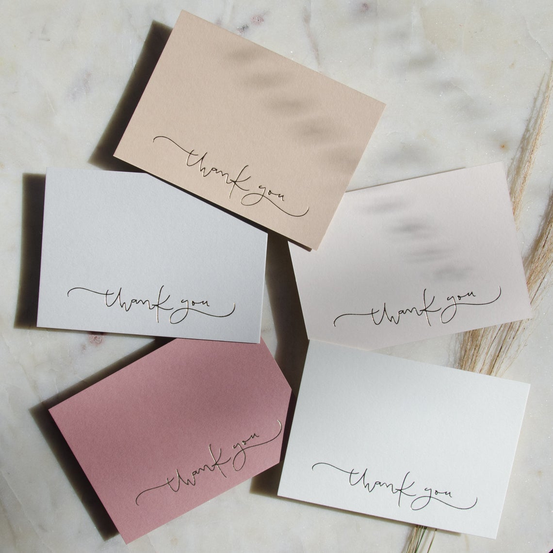 set of pink and gold cards