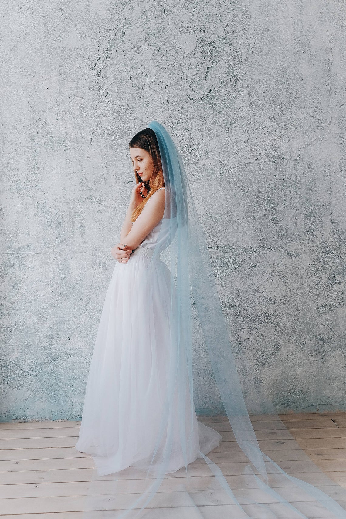 woman wearing long blue veil